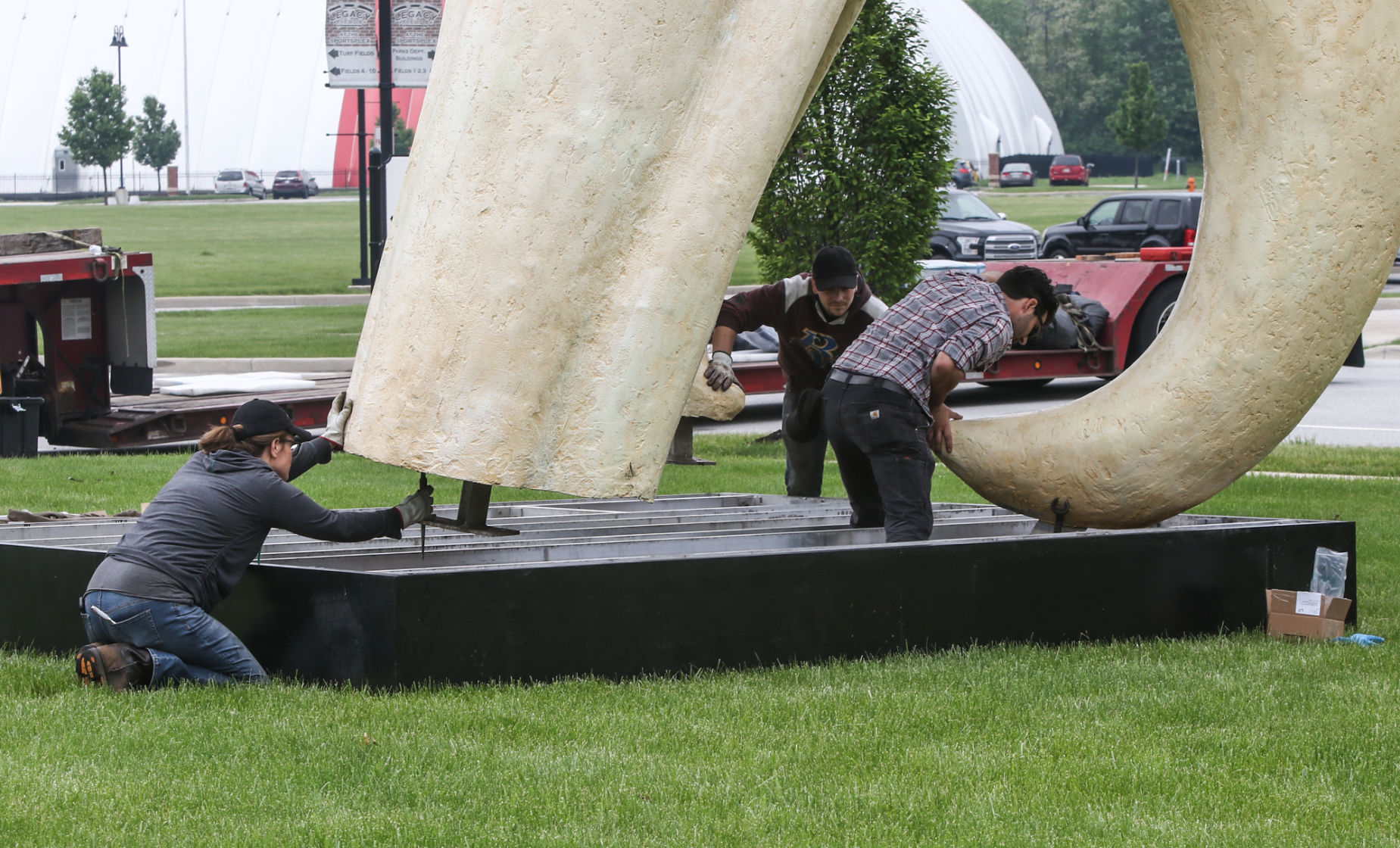 Artist Seward Johnson's "The Tooth" is implanted at the Crown Point Sportsplex